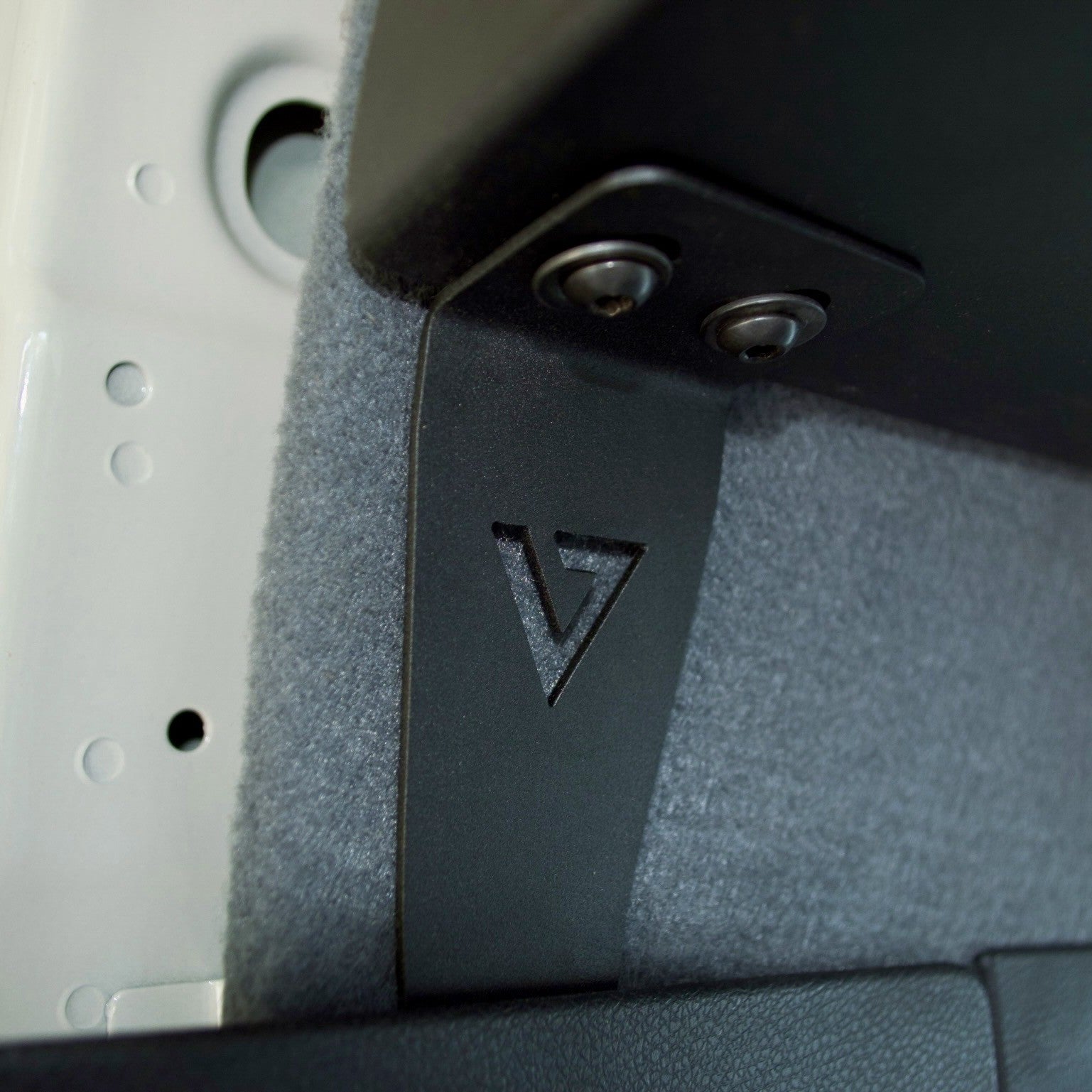 Stainless steel mounting bracket detail — Virtus Vans Sprinter headliner shelf hardware