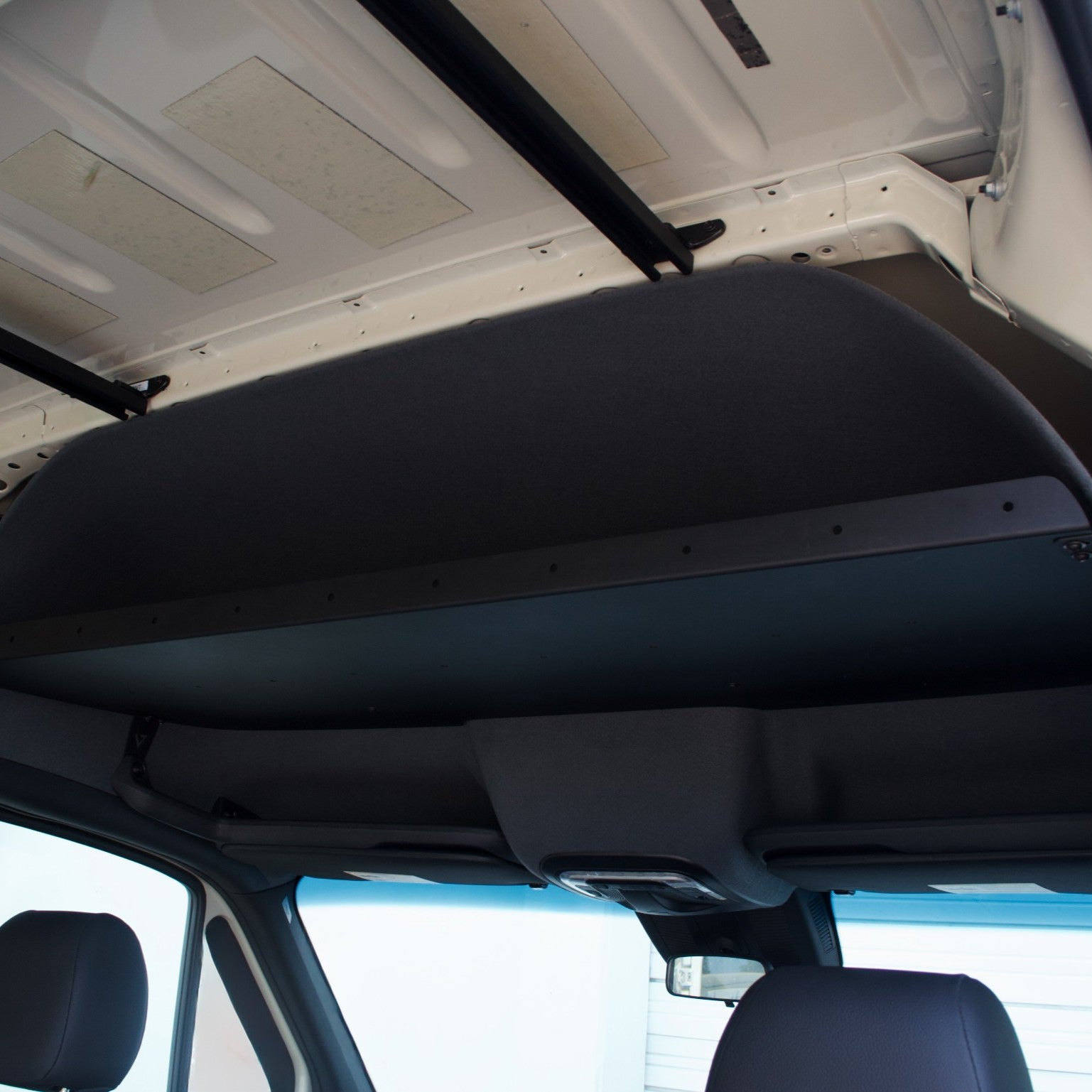 Virtus Vans headliner shelf without laminate face — raw aluminum finish, side view