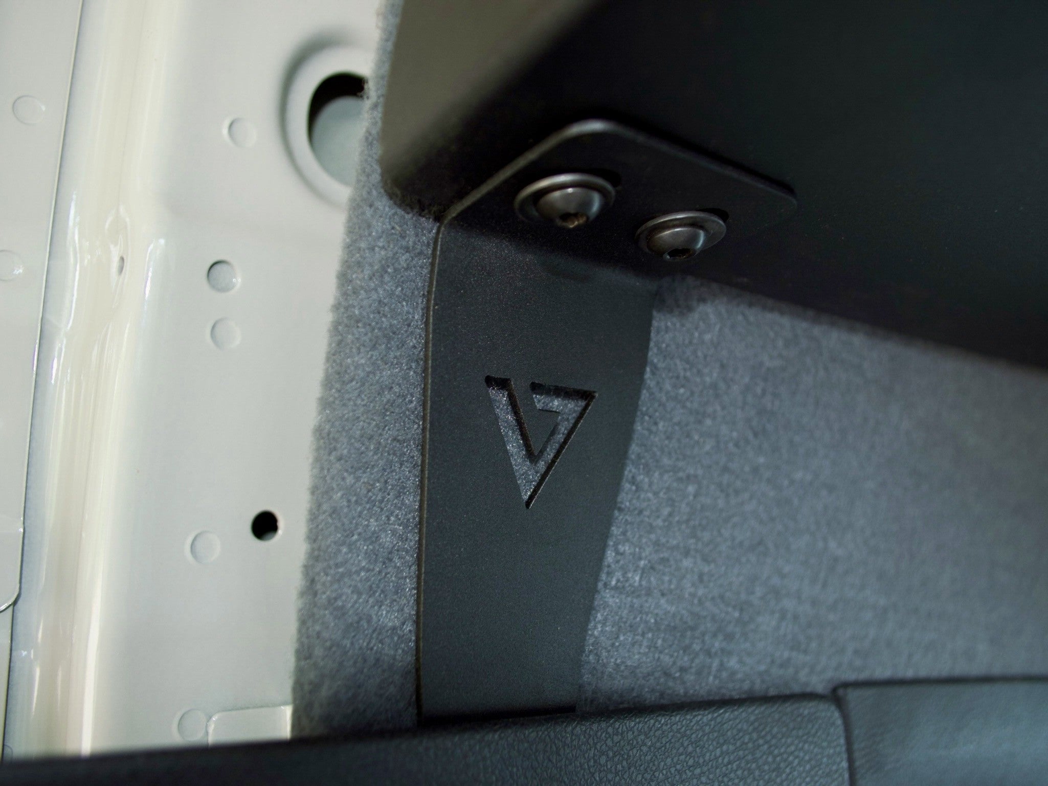 Stainless steel mounting bracket detail — Virtus Vans Sprinter headliner shelf hardware