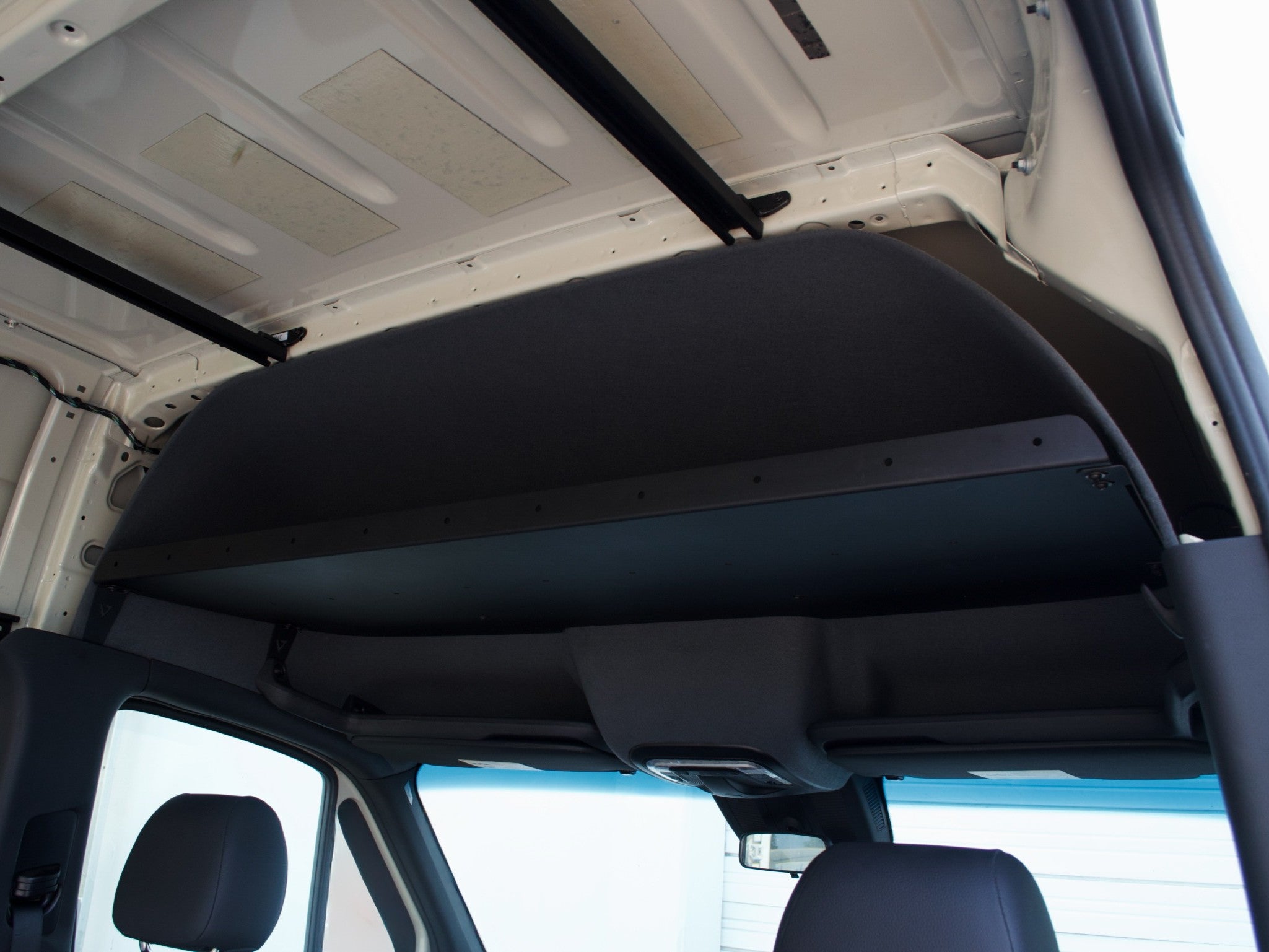 Virtus Vans headliner shelf without laminate face — raw aluminum finish, side view